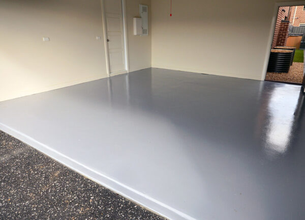 Grey epoxy coating on a concrete garage floor